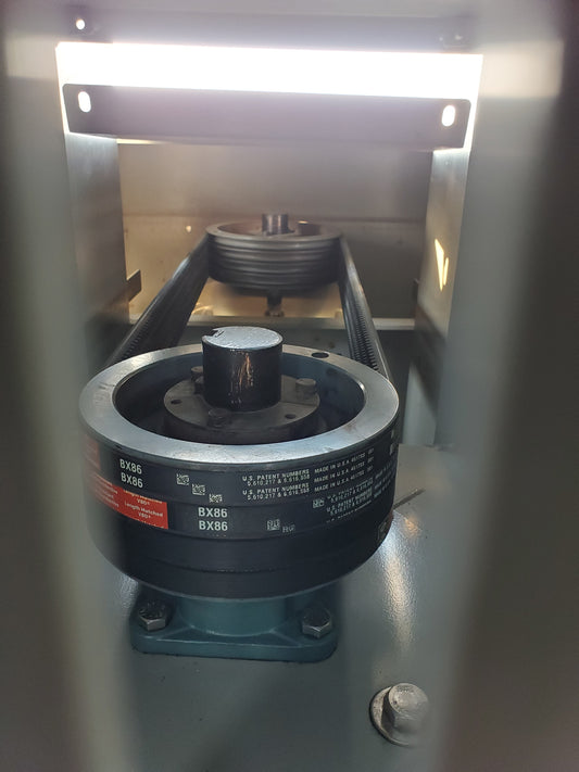 view of pulleys and 4 belts driving a fan